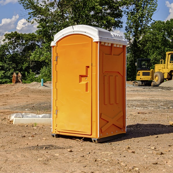 what is the cost difference between standard and deluxe portable restroom rentals in Lakemore